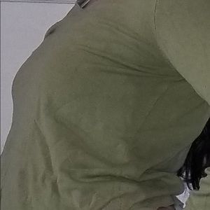 It is a tanish green v-neck